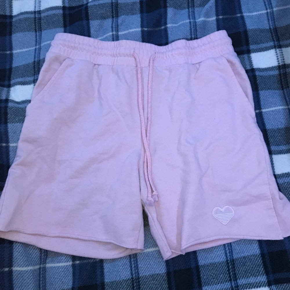 Pink shorts with a heart at the bottom